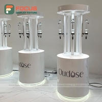 Support d'affichage de surface peint rond personnalisé avec éclairage LED, présentoir de vente au détail, meuble d'exposition de flacons de parfum