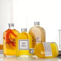 Bouteille en verre personnalisée avec couvercle, design à épaule inclinée, 150ml, 200ml, 350ml, 500ml – Spécifications pour vin et jus