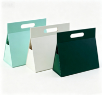 Boîte cadeau rigide sur mesure, boîte en carton trapézoïdale aux dimensions personnalisées avec poignée intégrée pour les commandes personnalisées d'entreprise