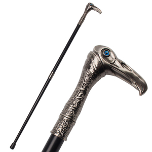 Canne vintage en métal avec yeux en pierre bleue et détails gravés pour la marche - Product Image 1