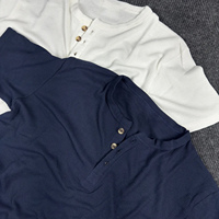 Nouveauté : T-shirts gaufrés légers et respirants personnalisables pour la vente en gros avec col Henley