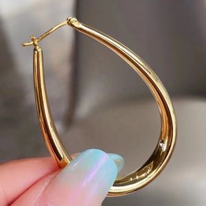 Xinfly Latest Fashion Hypoallergenic AU750 18K Pure Gold Teardrop Oval Chunky <b>Large</b> Lady Big <b>Hoop</b> Earrings for Woman - Product Image 2