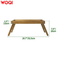WOQI Plateau de rangement écologique en bambou avec pieds pliants, parfait pour une utilisation avec un ordinateur portable dans le salon.