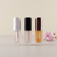 Tube de brillant à lèvres rond en verre de 10 ml, conteneur de gloss à lèvres à fond épais, emballage cosmétique vide avec pinceau et capuchon en plastique, logo personnalisé