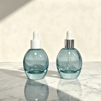 En stock, flacon compte-gouttes rond en verre de 50 ml, flacon de recharge pour sérum d'huile essentielle pour le visage