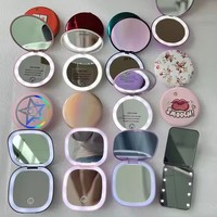 Miroirs à main bon marché lumière LED ronde beauté cosmétique 2X miroir de maquillage grossissant avec batterie rechargeable 400mah