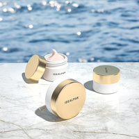 Pot de baume à lèvres en plastique rond de luxe personnalisé vide Contenants de cosmétique faciale à bouchon en plastique pour les soins de la peau Conteneur de crème pour le visage et les yeux