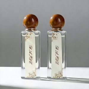 Custom Eco-friendly Glass Perfume <b>Bottle</b> 75ml 80ml Irregular Crimp Recyclable clear <b>Empty</b> Perfume <b>Bottle</b> with Colored Resin Cap - Product Image 1