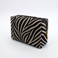 Sac de maquillage personnalisé en gros avec logo imprimé zèbre, pochette cosmétique en textile tissé noir et beige pour femme, voyage, luxe