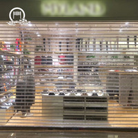Porte de volet roulant électrique transparente, porte antivol en cristal, porte de volet roulant en plastique épaissi dans un centre commercial intérieur