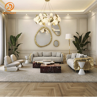 Table basse de luxe en marbre foncé avec pont en laiton doré organique, table centrale en bloc de pierre naturelle pour villa, hall d'hôtel