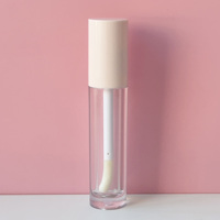 Tube de brillant à lèvres de forme ronde vide de 8ml emballage de tubes de cosmétiques clairs de couleur nue avec de petites brosses de baguette