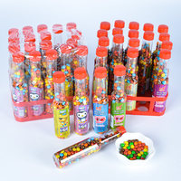 Vente en gros Bonbons haricots chocolat exotique arc-en-ciel Chocolat sucré solide avec emballage en vrac noix