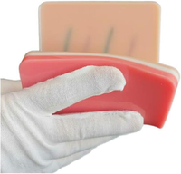 Coussin d'entraînement d'injection de silicone IV de modèle d'injection intraveineuse avec 4 veines intégrées et 3 couches de suture de peau humaine