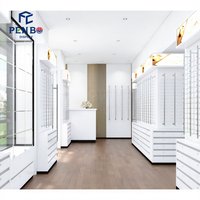 Solution de mise en espace de magasin sur mesure haut de gamme avec planification spatiale professionnelle et concept d'intérieur moderne pour la conception de magasins d'optique