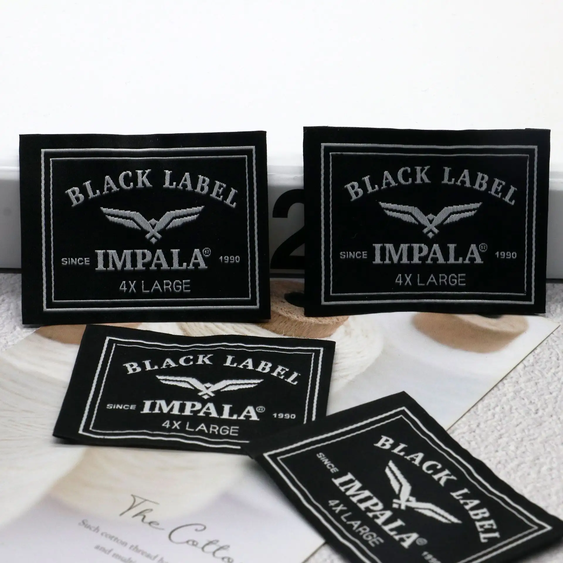 Label perawatan logam kosong tempel label perawatan kain kertas cetak untuk pelabelan garmen