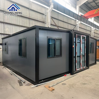 Tamamen Siyah Camlı Ön Cepheli Genişletilebilir Konteyner Ev, Tavandan Tabana Pencereler, Modern Balıksırtı Döşeme, Prefabrik Stüdyo, Depo Kullanımı