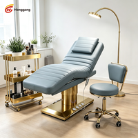 Table de massage électrique ergonomique professionnelle réglable en hauteur pour spa, avec LED, luxe moderne, pour hôtel et institut de beauté
