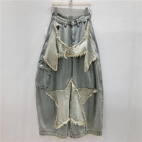 Jeans en denim baggy à jambe large pour femme, taille haute, déchiré, avec patch étoile, ourlet brut, coupe droite, style rétro Y2K chic, collection Printemps Automne 2026, vente en gros