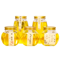 Grosir Pabrik 375ml 380ml 730ml stoples madu kaca segi enam heksagonal dengan tutup untuk penyimpanan makanan acar Jam