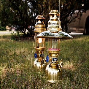 Shiny polished <b>brass</b> pressure oil <b>lanterns</b> with round glass globes and top shades, available at wholesale prices. - Product Image 1