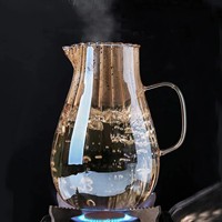 Vente en gros de carafes en verre borosilicate résistant à la chaleur, avec couvercle en acier inoxydable, poignée en verre, capacité de 1,8 L, compatible micro-ondes, sans BPA