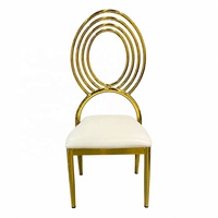 Chaise de luxe ovale en fer doré électrolytique avec assise en cuir blanc pour salle à manger d'hôtel, salon, villa, événements et banquets de mariage