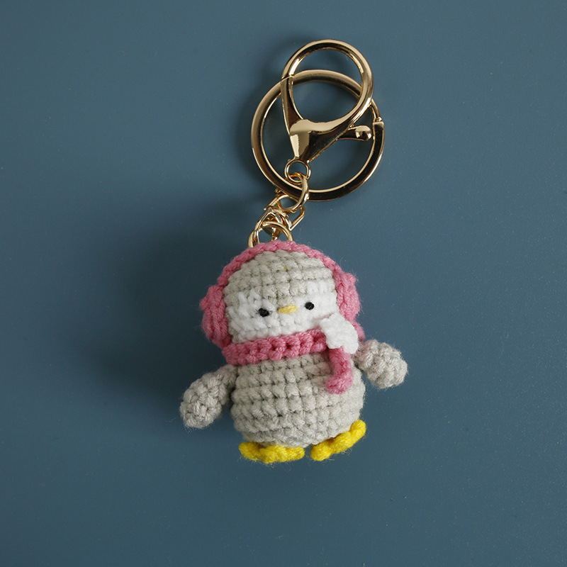 Pingüino con auriculares rosa