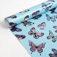 Kit d'emballage cadeau recyclable personnalisé avec motif papillon bleu pastel, comprenant du papier d'emballage pour bouquet, un sac en papier de Noël et un rouleau de papier d'emballage