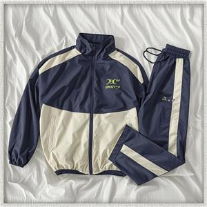 Conjunto Deportivo Informal Transpirable Personalizado, Chaqueta con Cremallera Bordada, Pantalones Jogger, Conjunto de Chándal Cortavientos de Nailon con Bloques de Color para Hombre - Product Image 2