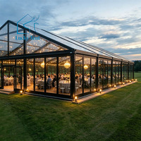 Tente de réception de luxe en aluminium noir avec toit transparent et parois en verre trempé pour mariage, banquet et gala en extérieur