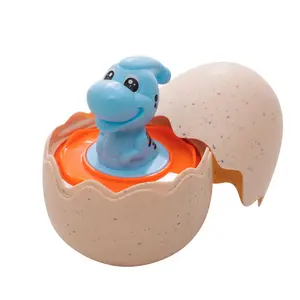 Prezzo all'ingrosso regalo di pasqua di plastica spremere giocattoli di filatura Top dinosauro uovo per i bambini