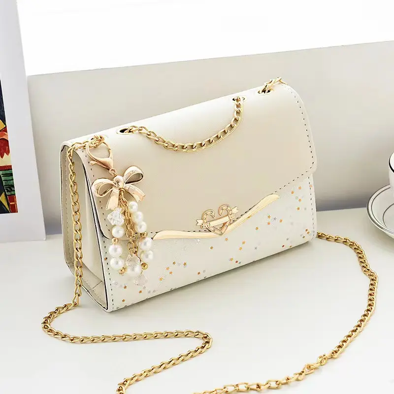 Bolsa de mão de mão de confete para meninas, bolsa de mão com alça de corrente dourada para mulheres, decoração com laço, corpo cruzado, moda de 2024, atacado