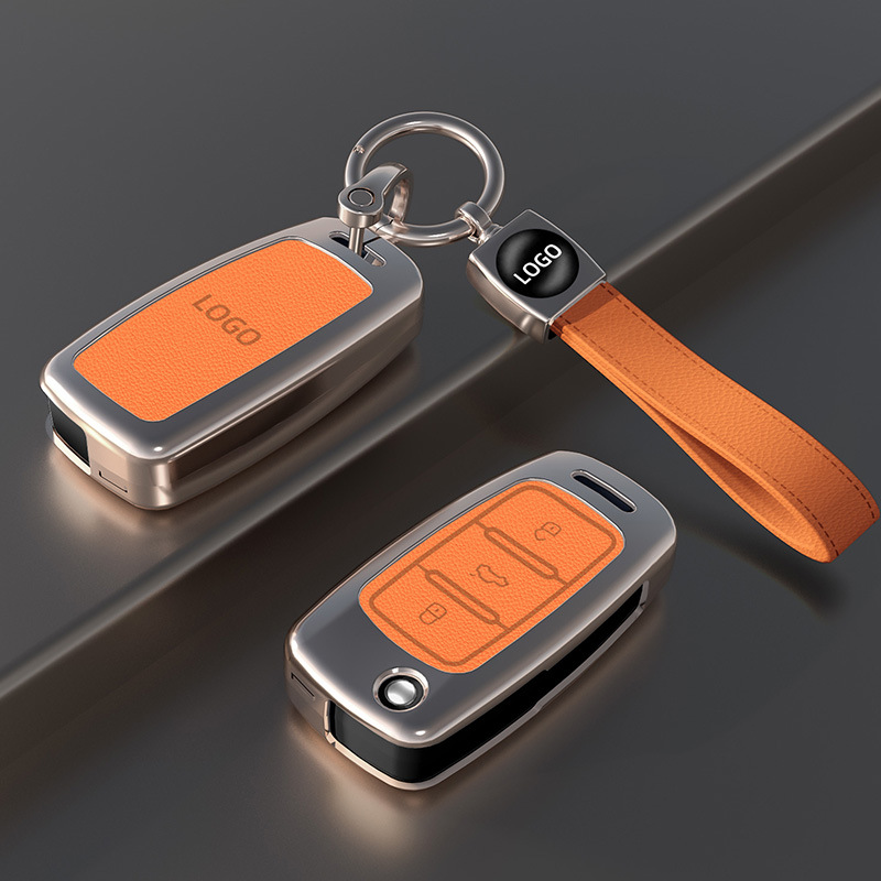 Un juego de llaves naranja con correa para la muñeca.