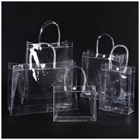 Sac fourre-tout transparent en PVC refermable avec fermeture éclair et poignées pour masques faciaux et cosmétiques, surface brillante portable