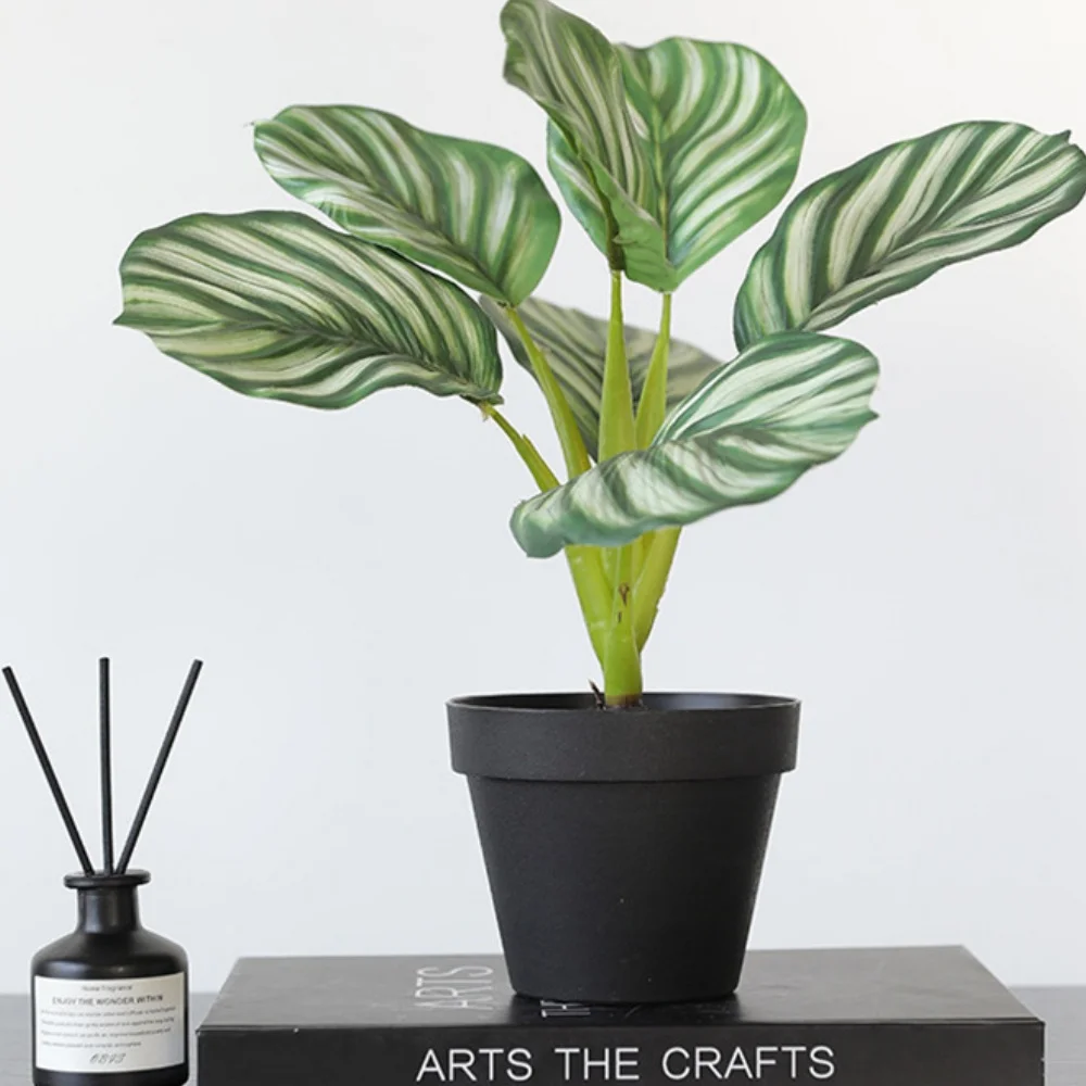 Feuille de pommier artificielle vert jaunâtre en pot 34cm