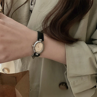 Montre ovale de luxe légère pour femme, petit modèle 37 mm, en cuir véritable, mouvement à quartz, cadran à aiguilles, boîtier en acrylique, haut de gamme