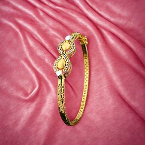 Designer gold bangle for women with artistic cutwork and infinity <b>inspired</b> pattern by kinnova jewels stylish lightweight daily - Product Image 1