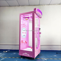 Machine à prix à ciseaux verticale commerciale à monnayeur, avec bordure néon rose et roue mobile, pour centre commercial et salle d'arcade, garantie 1 an