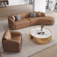 Ensemble de canapés en cuir italien moderne avec design arqué pour hall d'hôtel, comprenant canapé, chaise et table, pour mobilier de réception de salon