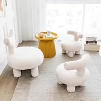 Fauteuil enfant moderne en tissu crème avec dossier bas réglable et petit banc à chaussures pour salons domestiques