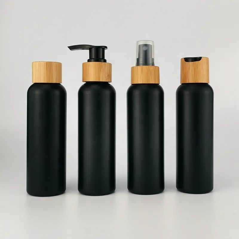 Bouteilles de 4 oz noir mat Bouteille PE-HD en plastique noir de 120 ml avec bouchon en bambou pour emballage cosmétique