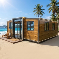 Maison conteneur extensible préfabriquée avec revêtement en bois de chêne et structure métallique foncée, villa tropicale front de plage, vente en gros, fournisseur d'usine