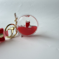 Porte-clés liquide en acrylique OEM ODM de Noël, figurine de Père Noël personnalisée, formes de conteneurs multiples