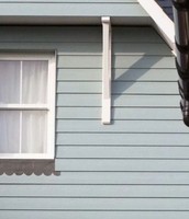 Panneau extérieur en fibrociment à finition grain de bois moderne, résistant aux intempéries et au feu, pour revêtement mural de façade de maison et décoration de plafond