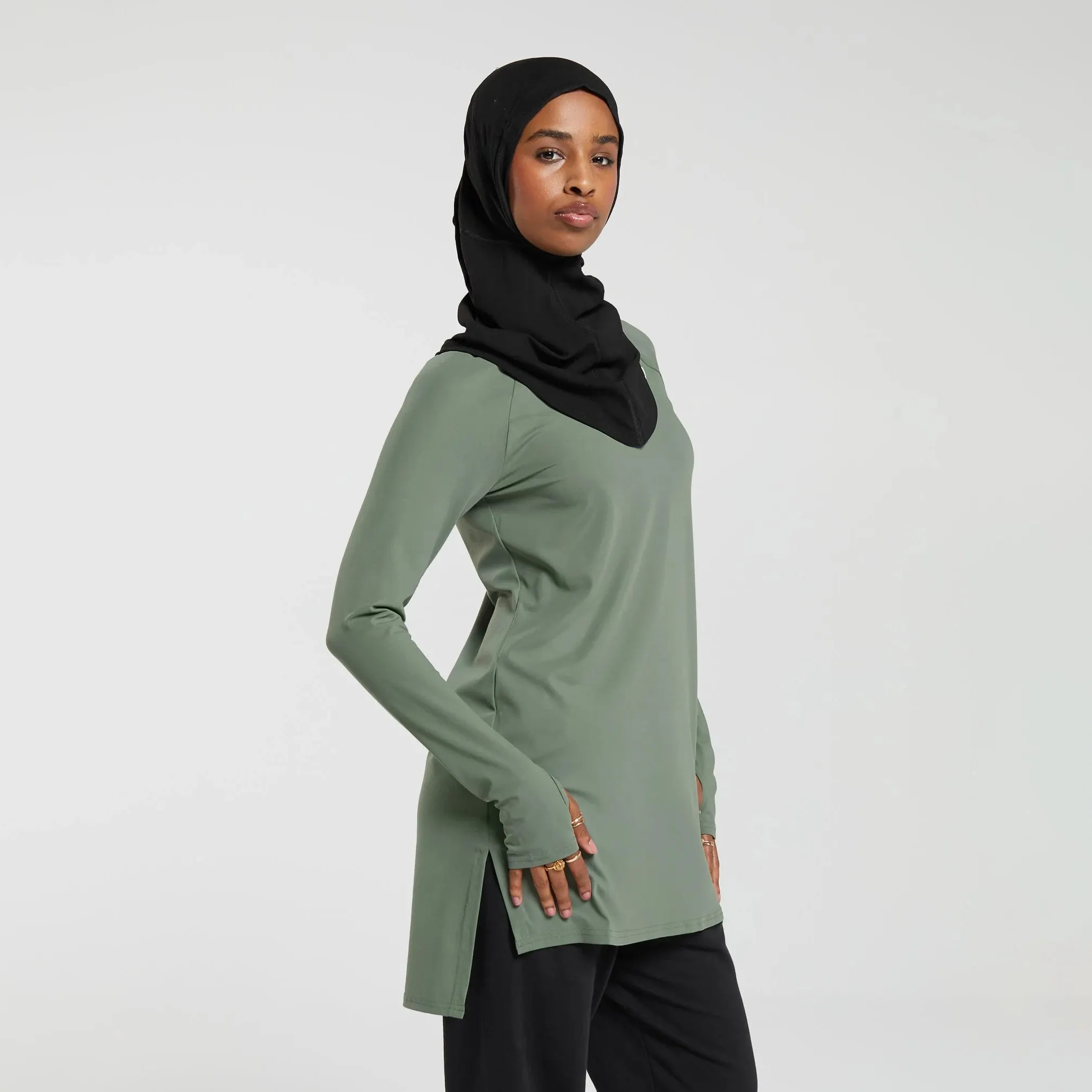 Maglietta sportiva da donna con top sportivi a maniche lunghe islamiche con orlo diviso