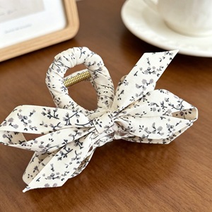 Korean style small floral fabric wrap-around crisscross hair <b>clip</b>, a popular and simple hair accessory for updos. - Product Image 4