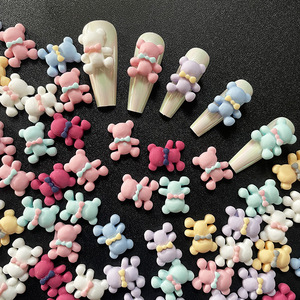 Venta al por mayor dibujos animados lindo oso 3D peluche <span class=keywords><strong>uñas</strong></span> diamantes de imitación giratorio rojo cálido Color para niñas giratorio diseño tridimensional - Product Image 1