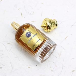 Botella de Perfume de Vidrio Vacía Irregular Única con Pulverizador de Bomba, 100ml, Tapa Dorada con Corona, Serigrafiada, Ecológica y Reciclable - Product Image 5