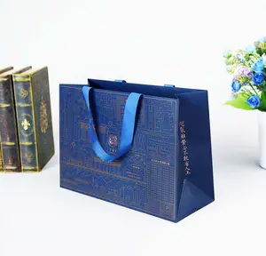 Bolso de lujo azul personalizado con logotipo DE VOTRE Pro, bolsa de embalaje de papel de compras de ropa de regalo pla